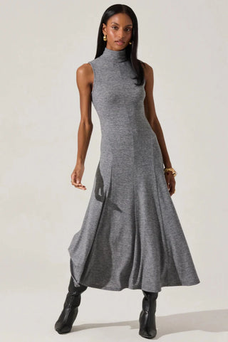 Woman wearing a gray sleeveless dress on a white background