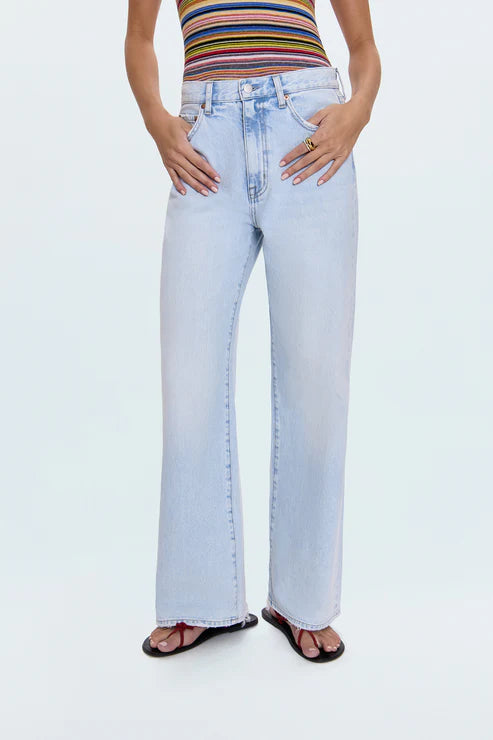 Light blue jeans worn by a person on a white background