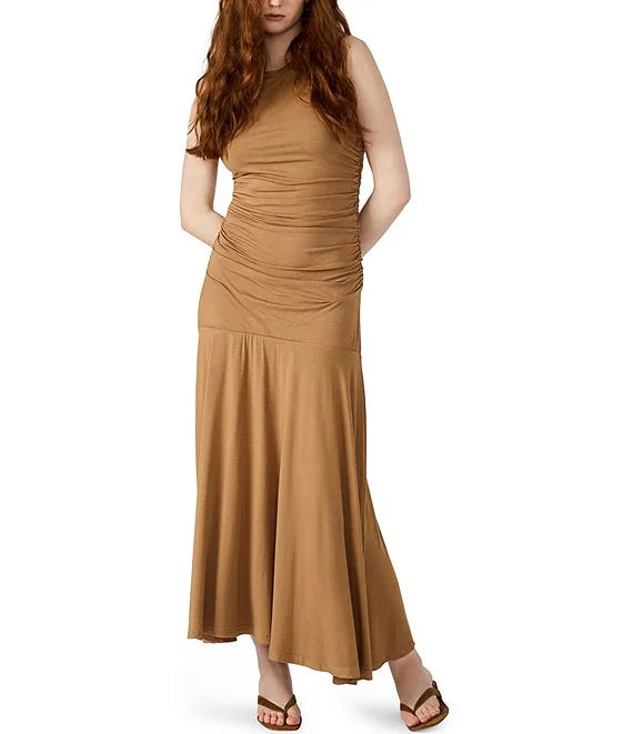 Woman wearing a brown dress on a white background