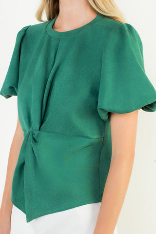 Green blouse with short sleeves on a white background
