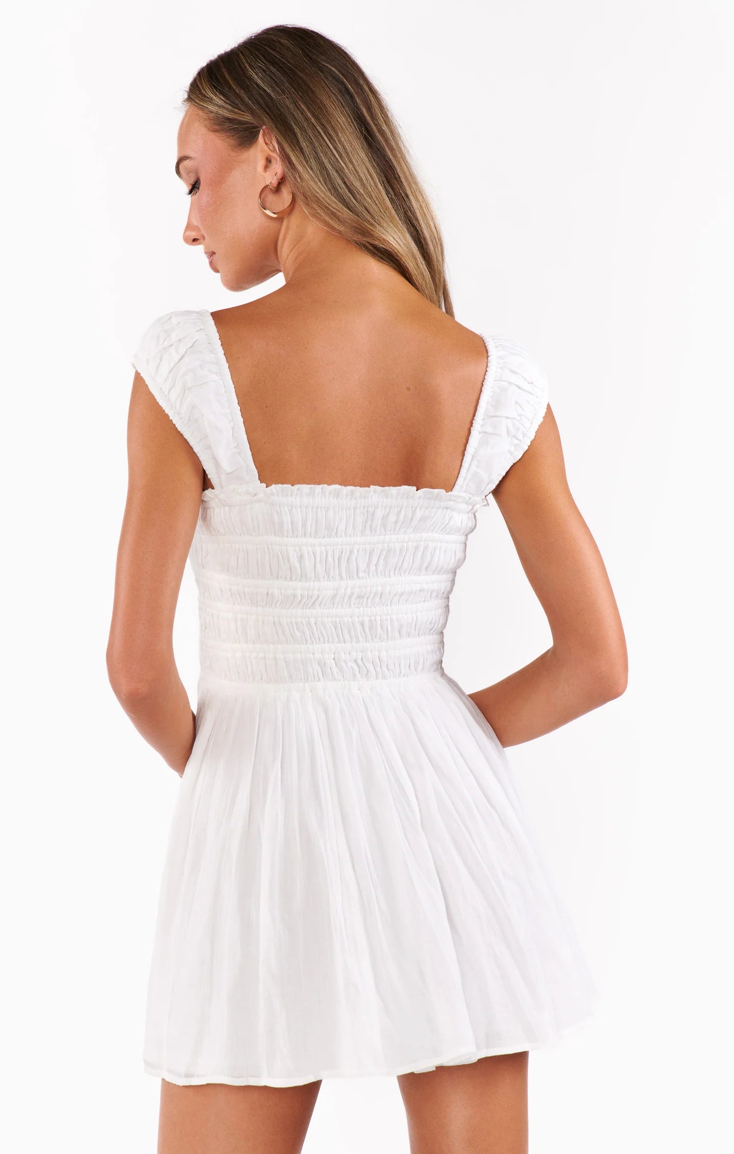 Woman wearing a white dress with black lace STMT BOUTIQUE 