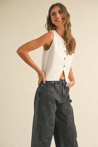 knit vest closeup with metal button detail