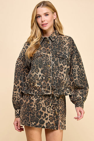 Woman wearing a leopard print outfit on a beige background
