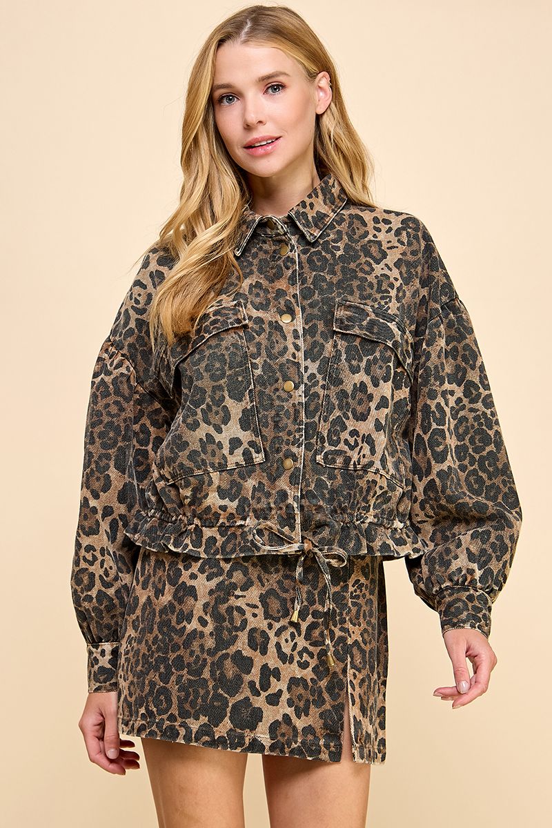 Woman wearing a leopard print outfit on a beige background