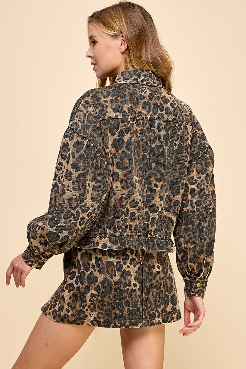 Woman wearing a leopard print outfit on a beige background