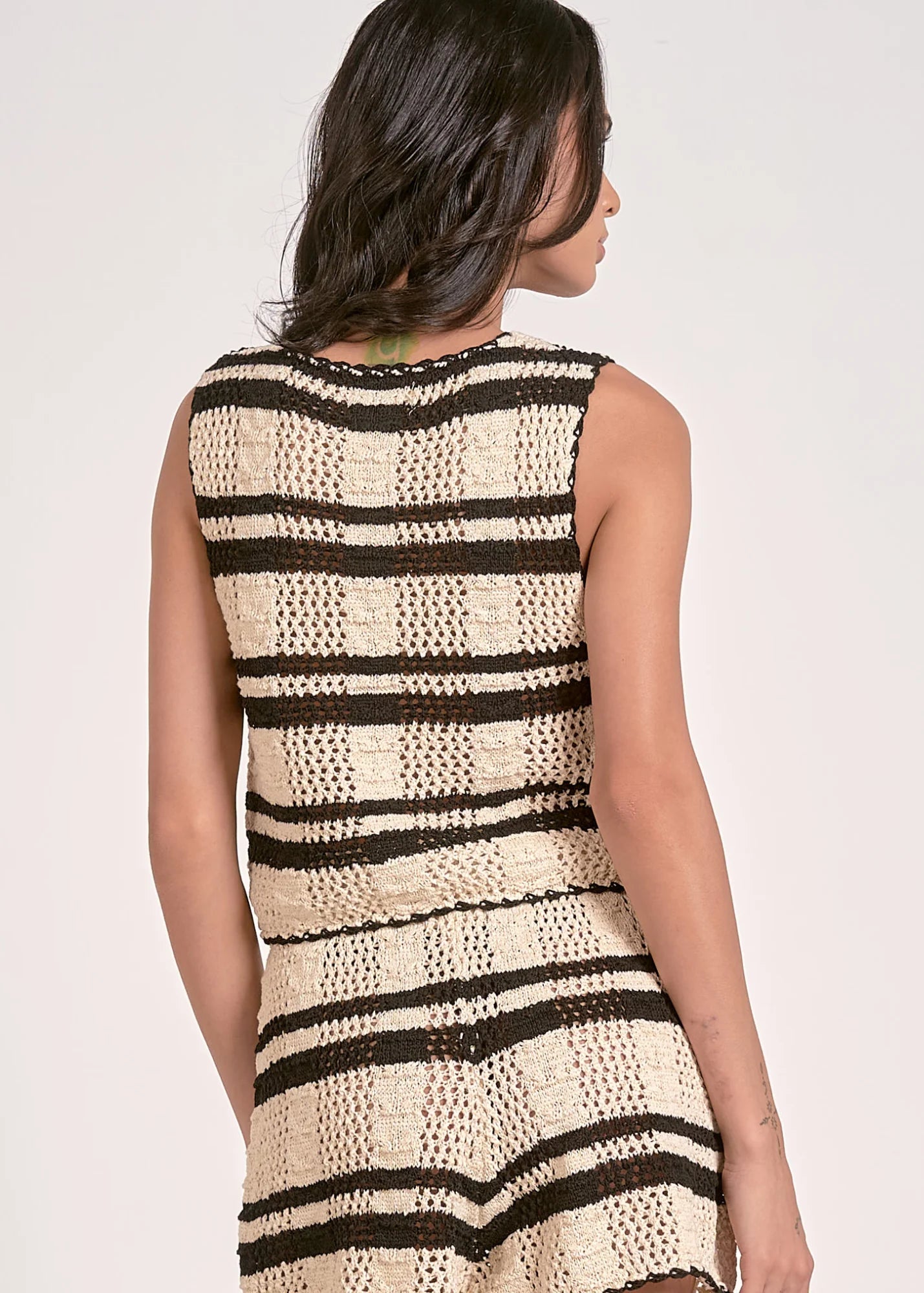 STMT TOP VEST TIE FRONT styled for a chic layered look