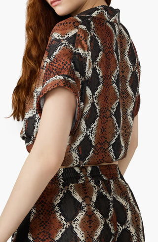 Patterned top worn by a person on a white background