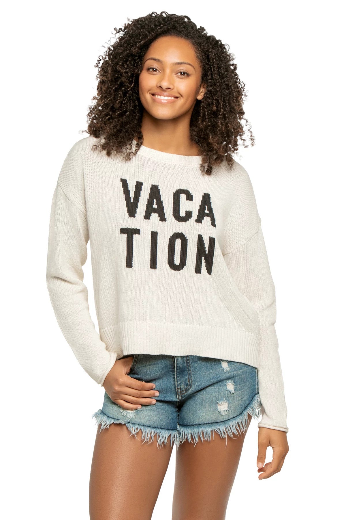 Editorial-inspired photoshoot featuring VACATION SIENNA SWEATER