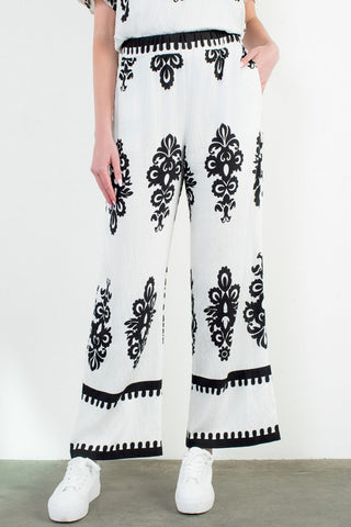 WIDE LEG PRINT PANTS styled for an elevated vacation-ready look