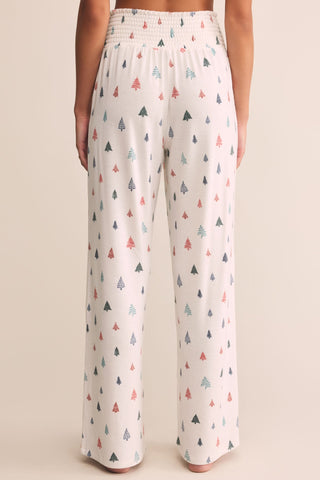 Wide-leg pants with a pattern of small trees on a plain background